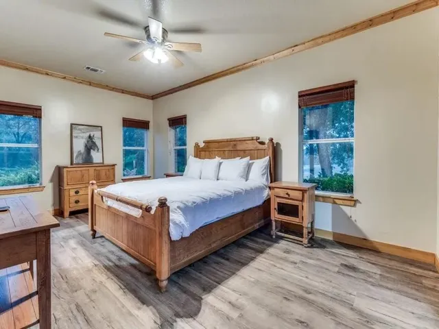 a bathroom with a double vanity sink mirror and bathtub