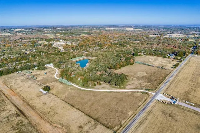 a view of park with large trees
