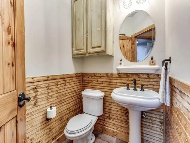 a view of room with wooden floor and a window