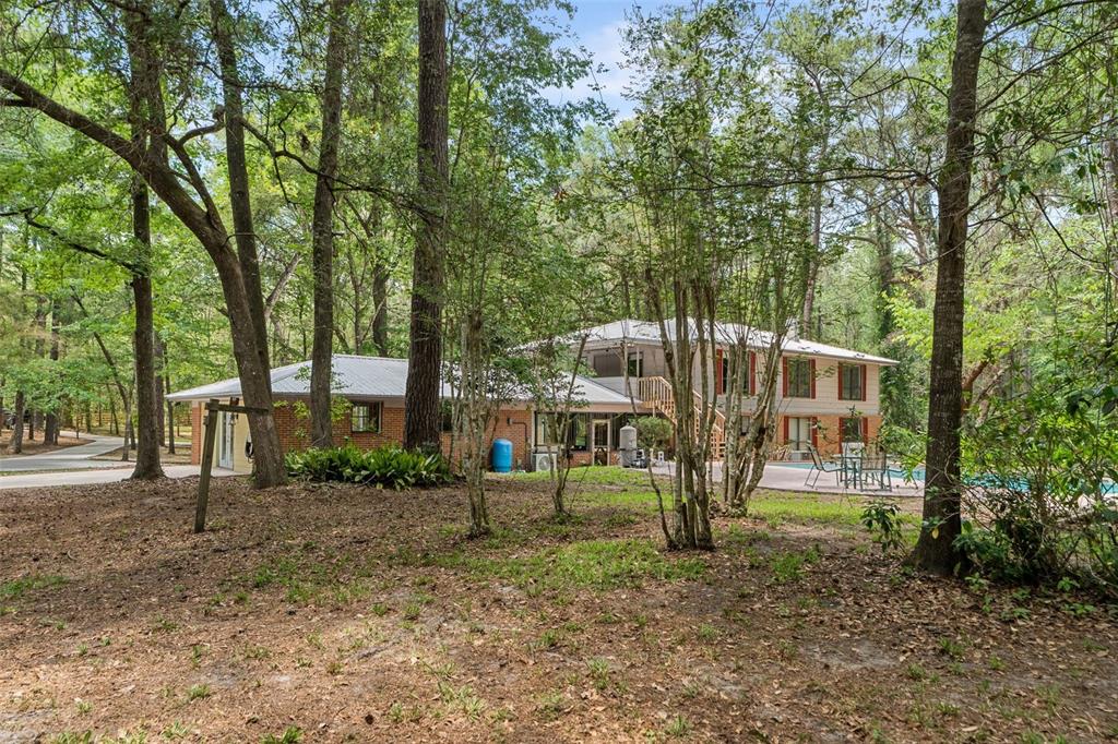 4703 Northwest 124th Street Gainesville, FL 32606 - Photo 50 of 55 a view of a house with a yard