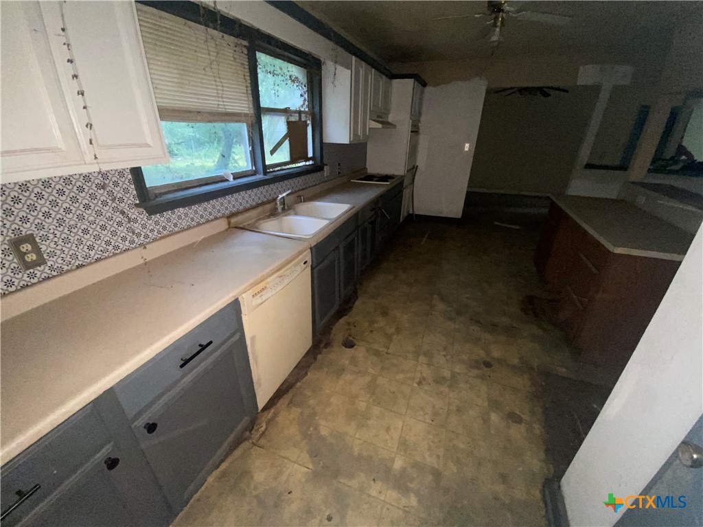 218 Cheeves Avenue Port Lavaca, TX 77979 - Photo 16 of 25 a kitchen with a sink and a stove