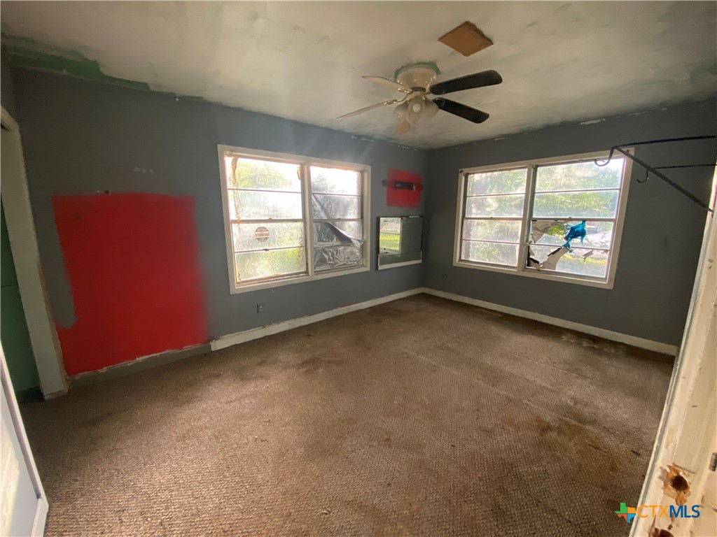 218 Cheeves Avenue Port Lavaca, TX 77979 - Photo 22 of 25 a view of an empty room with a window