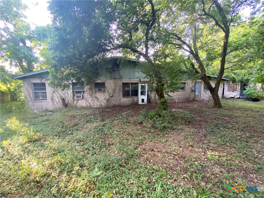 218 Cheeves Avenue Port Lavaca, TX 77979 - Photo 25 of 25 a front view of house with yard and trees
