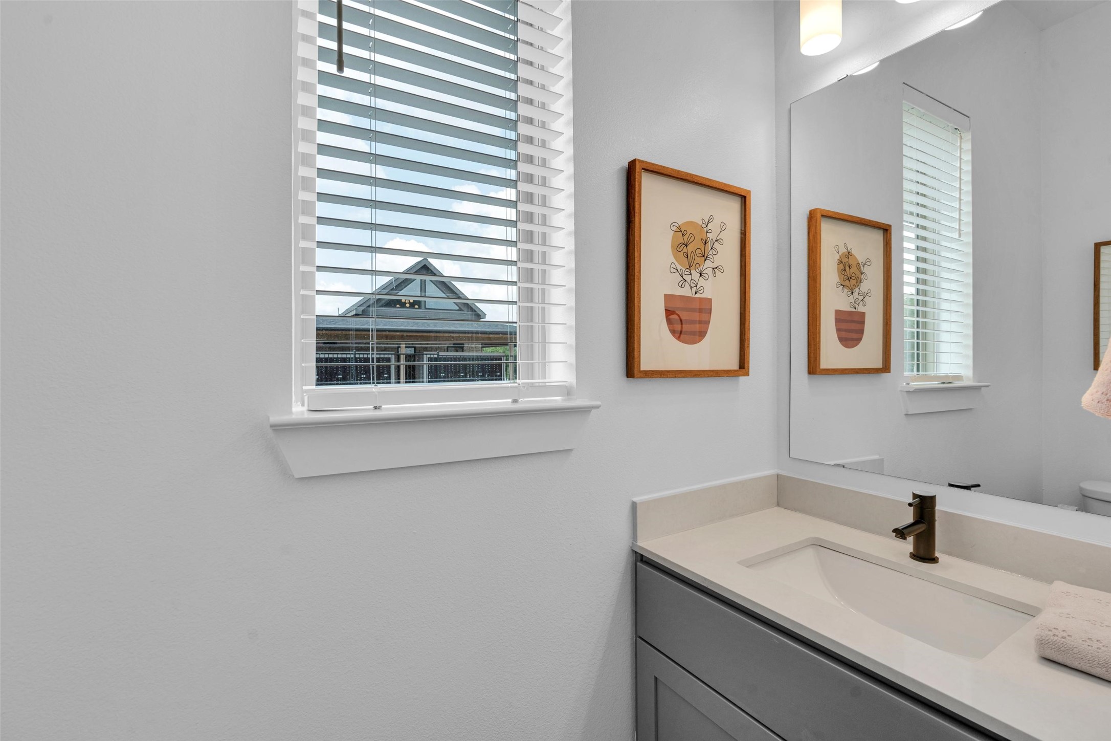 2020-710 Boykin Way Garland, TX 75040 - Photo 12 of 41 a bathroom with a sink and a mirror