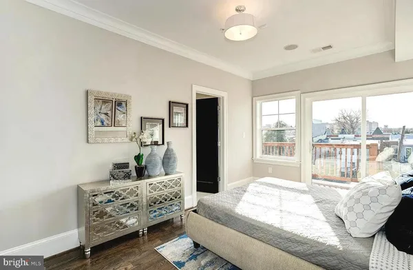 a bedroom with furniture and windows