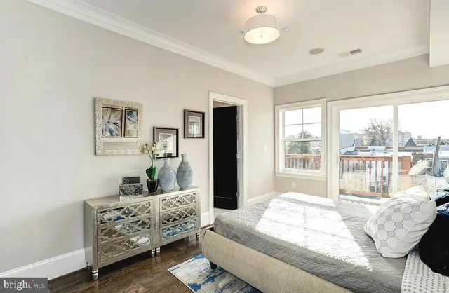 a bedroom with furniture and windows