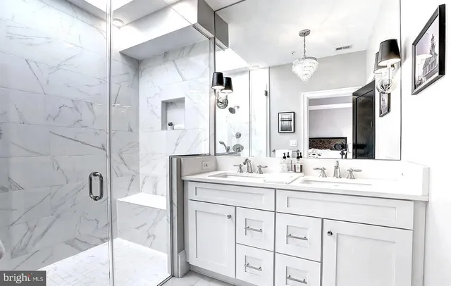 a bathroom with a sink double vanity and a mirror