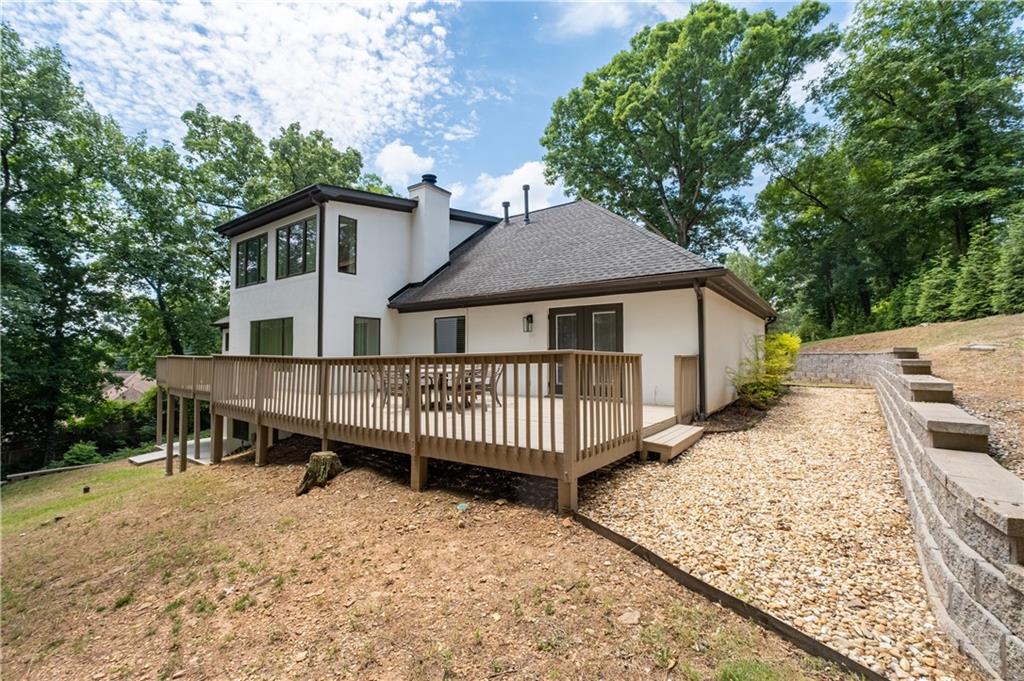 4610 West Morton Road Alpharetta, GA 30022 - Photo 50 of 53 a view of a house with a deck and a yard
