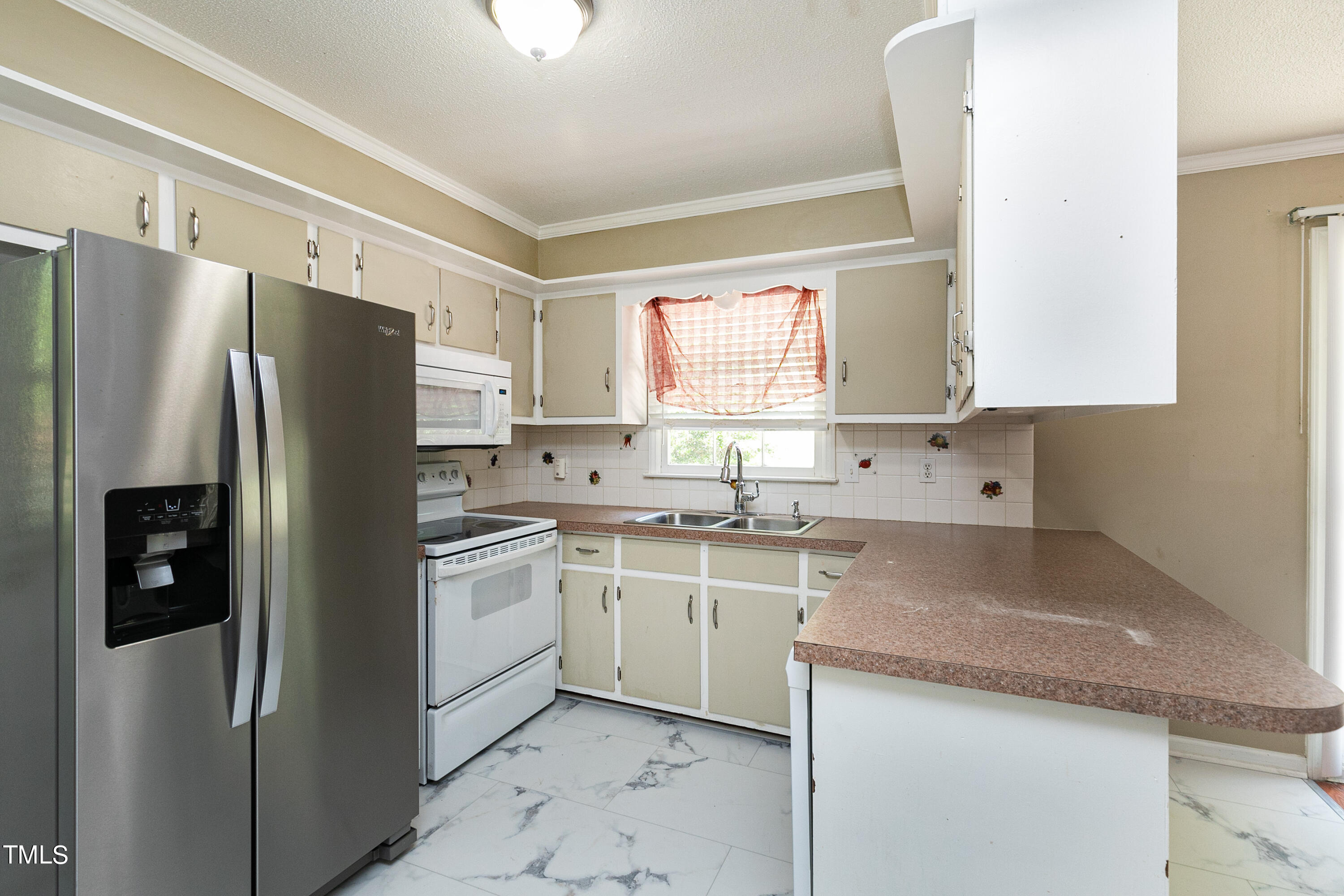 5841 Sandstone Drive Durham, NC 27713 - Photo 13 of 35 a kitchen with stainless steel appliances granite countertop a refrigerator and a sink