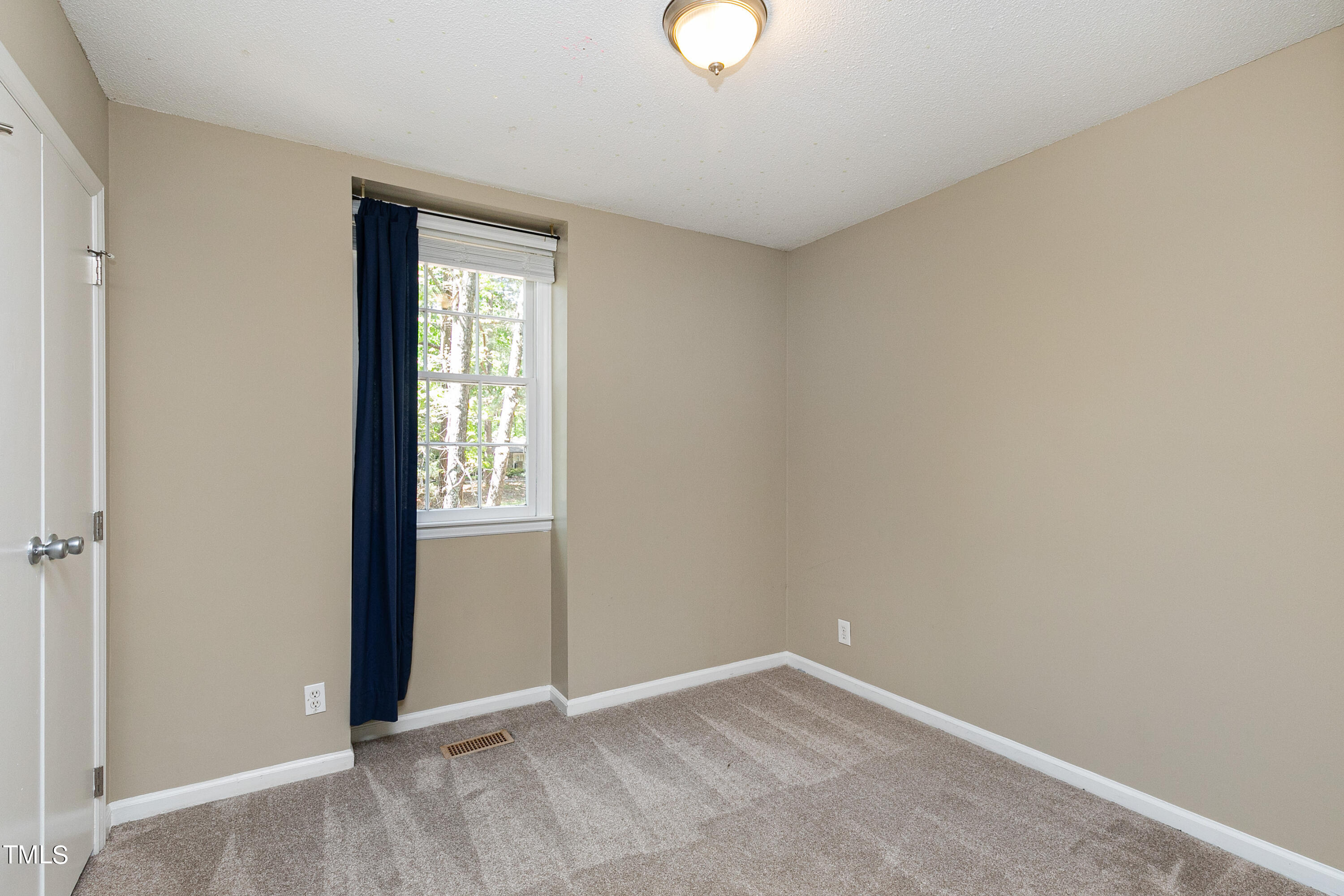 5841 Sandstone Drive Durham, NC 27713 - Photo 20 of 35 an empty room with windows