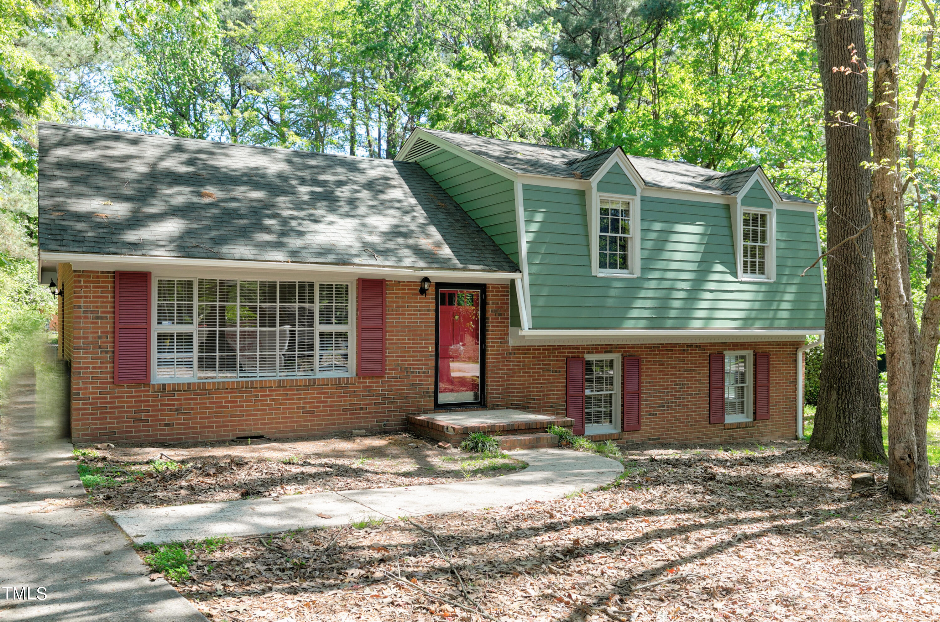 5841 Sandstone Drive Durham, NC 27713 - Photo 2 of 35 a front view of a house with a yard and garage