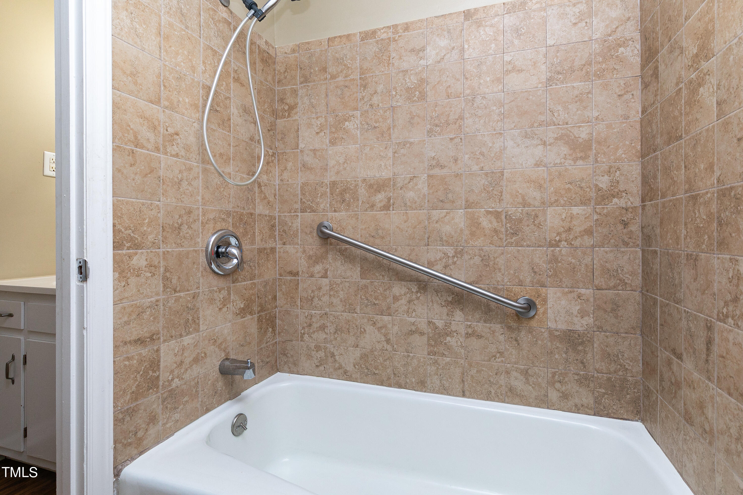 5841 Sandstone Drive Durham, NC 27713 - Photo 25 of 35 a bathroom with a bathtub