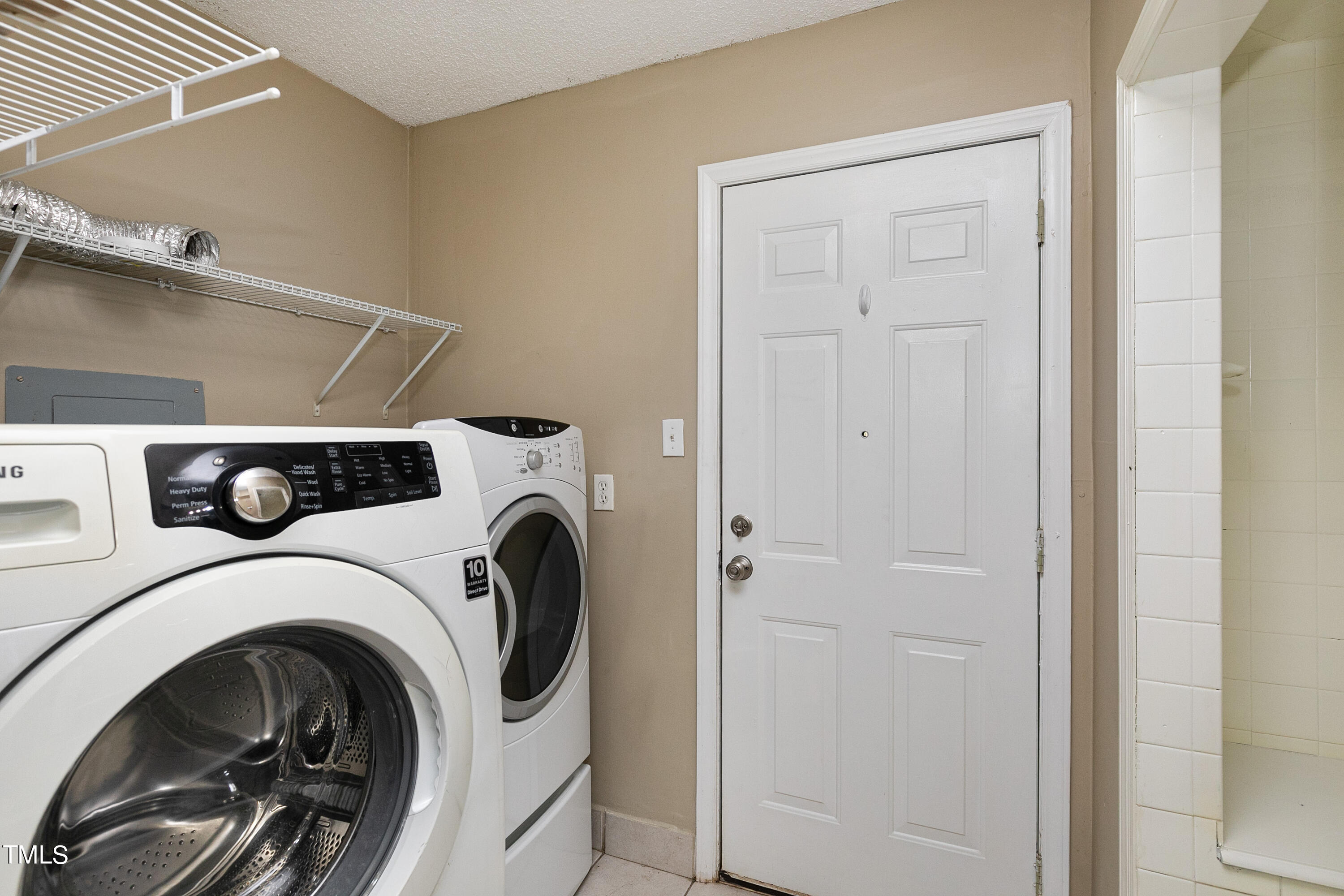 5841 Sandstone Drive Durham, NC 27713 - Photo 28 of 35 a utility room with dryer and washer