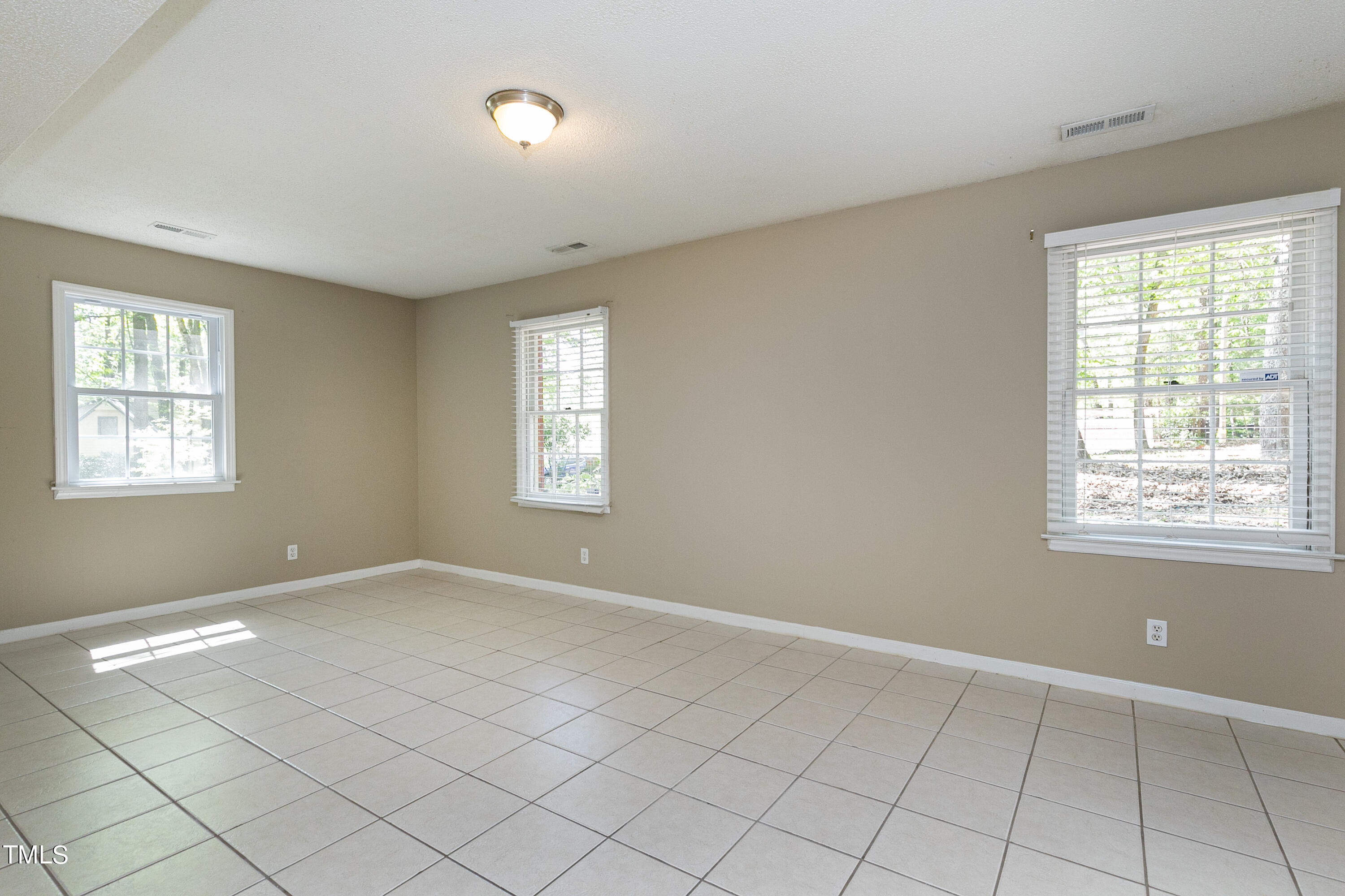 5841 Sandstone Drive Durham, NC 27713 - Photo 30 of 35 a view of an empty room with a window