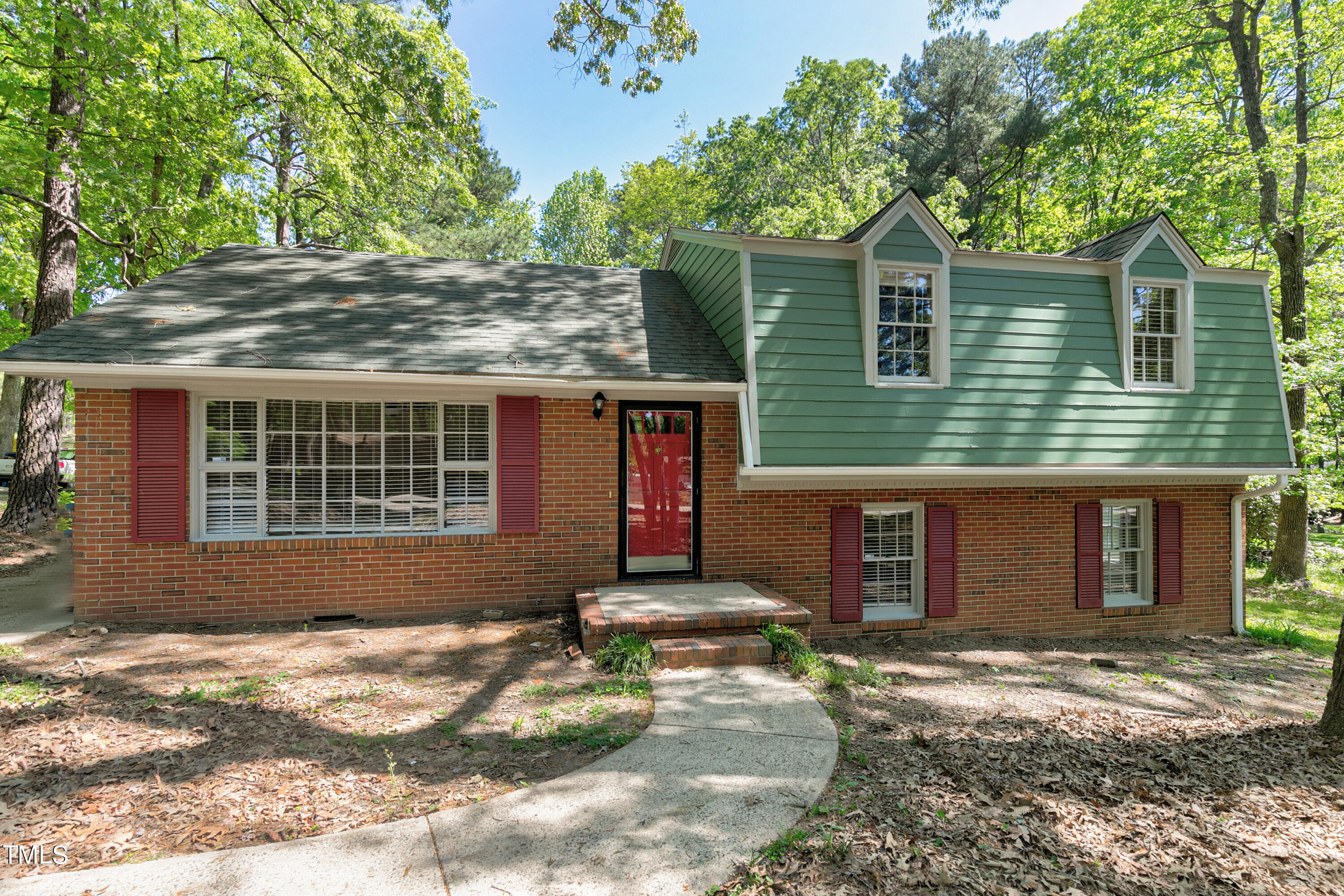 5841 Sandstone Drive Durham, NC 27713 - Photo 3 of 35 a front view of a house with a yard