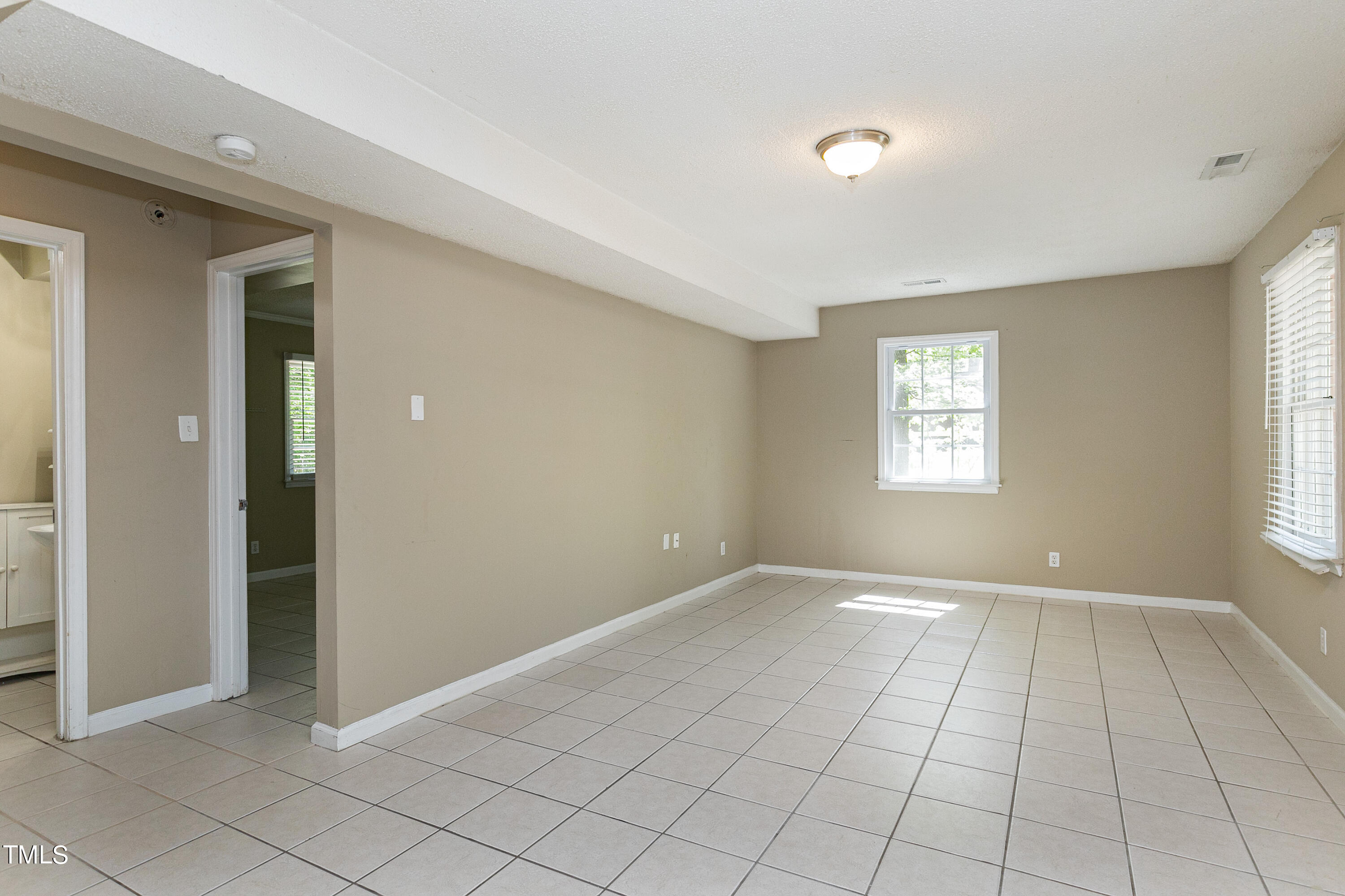 5841 Sandstone Drive Durham, NC 27713 - Photo 31 of 35 an empty room with windows and closet