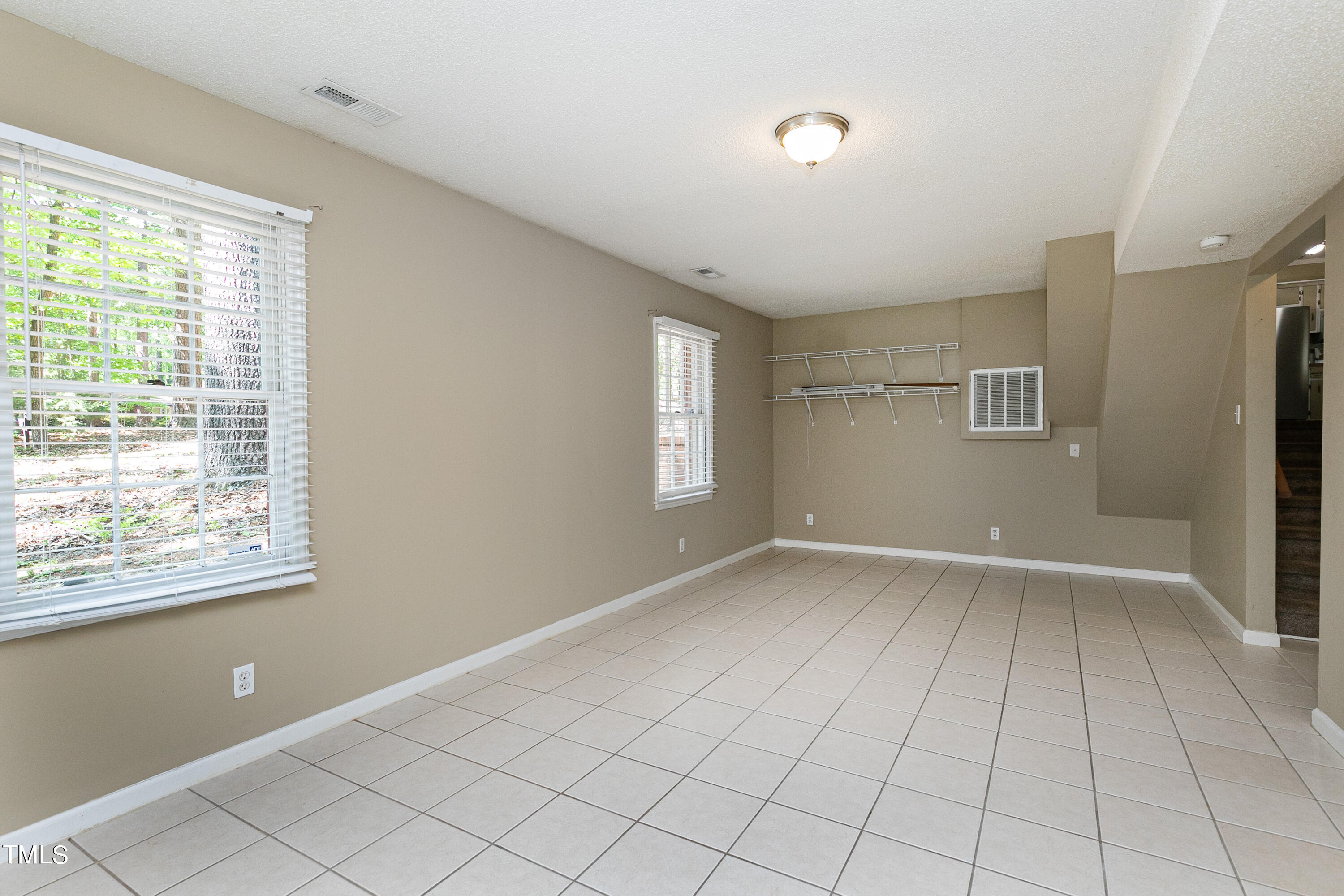 5841 Sandstone Drive Durham, NC 27713 - Photo 32 of 35 a view of an empty room with a window