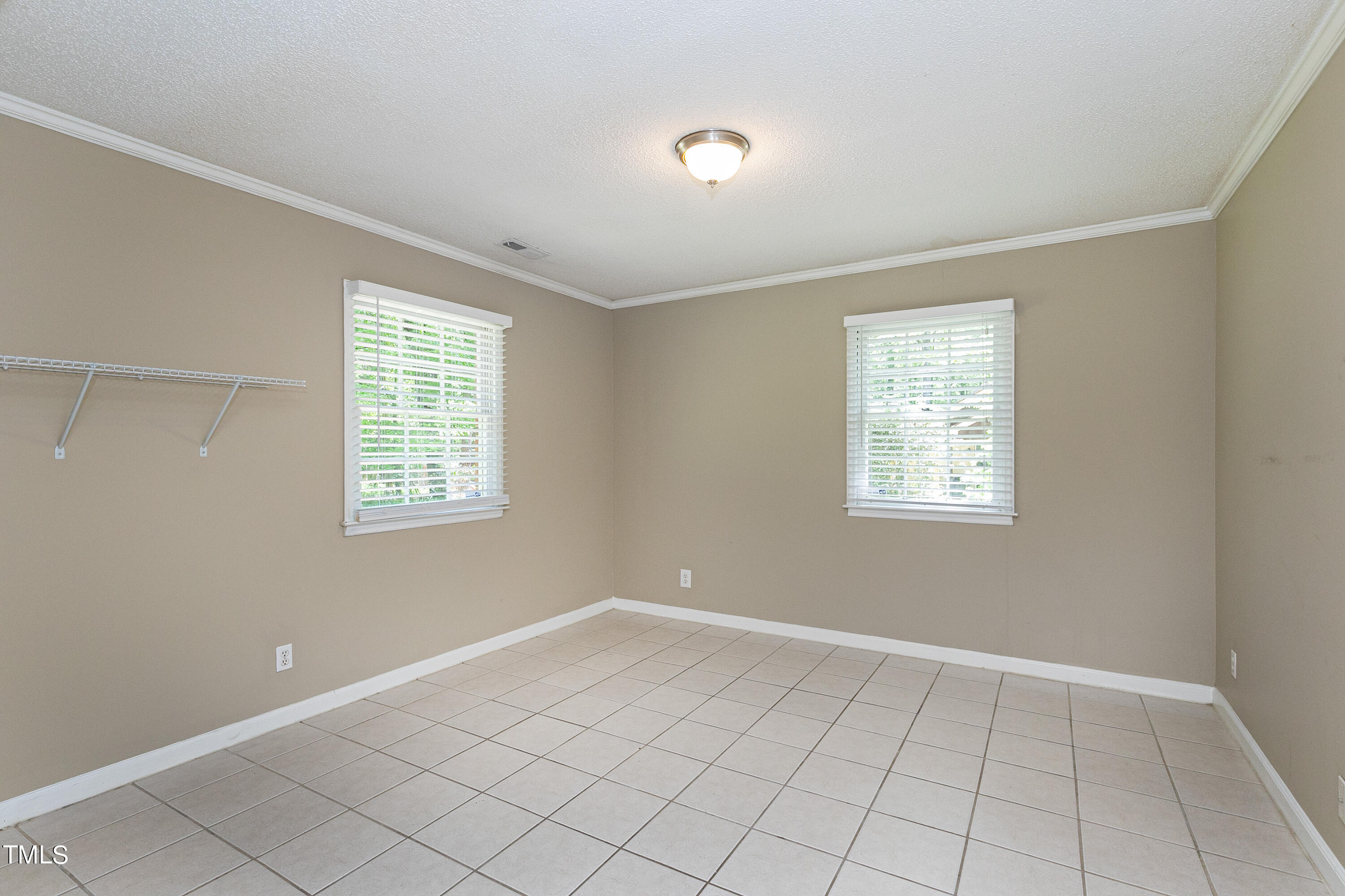 5841 Sandstone Drive Durham, NC 27713 - Photo 33 of 35 an empty room with windows