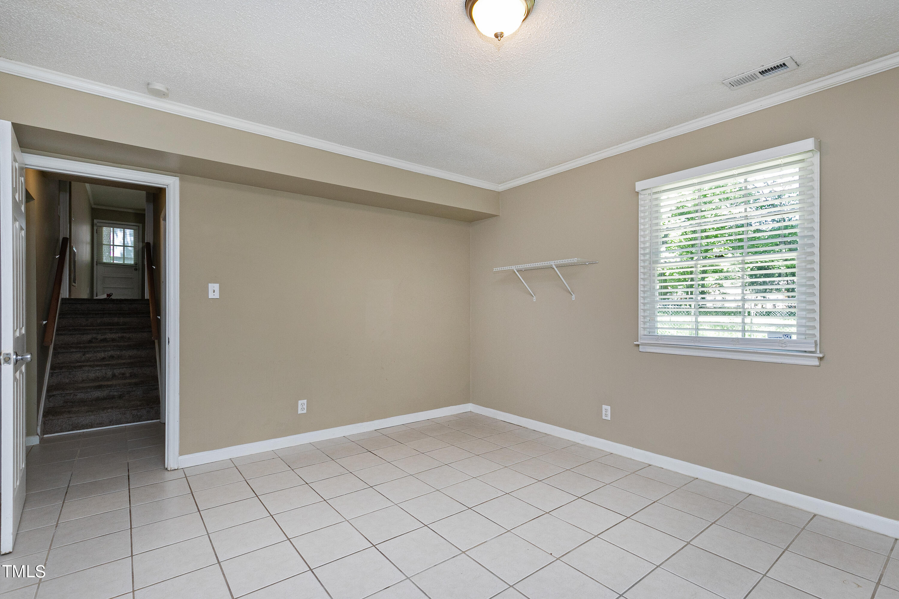 5841 Sandstone Drive Durham, NC 27713 - Photo 34 of 35 wooden floor in an empty room with a window