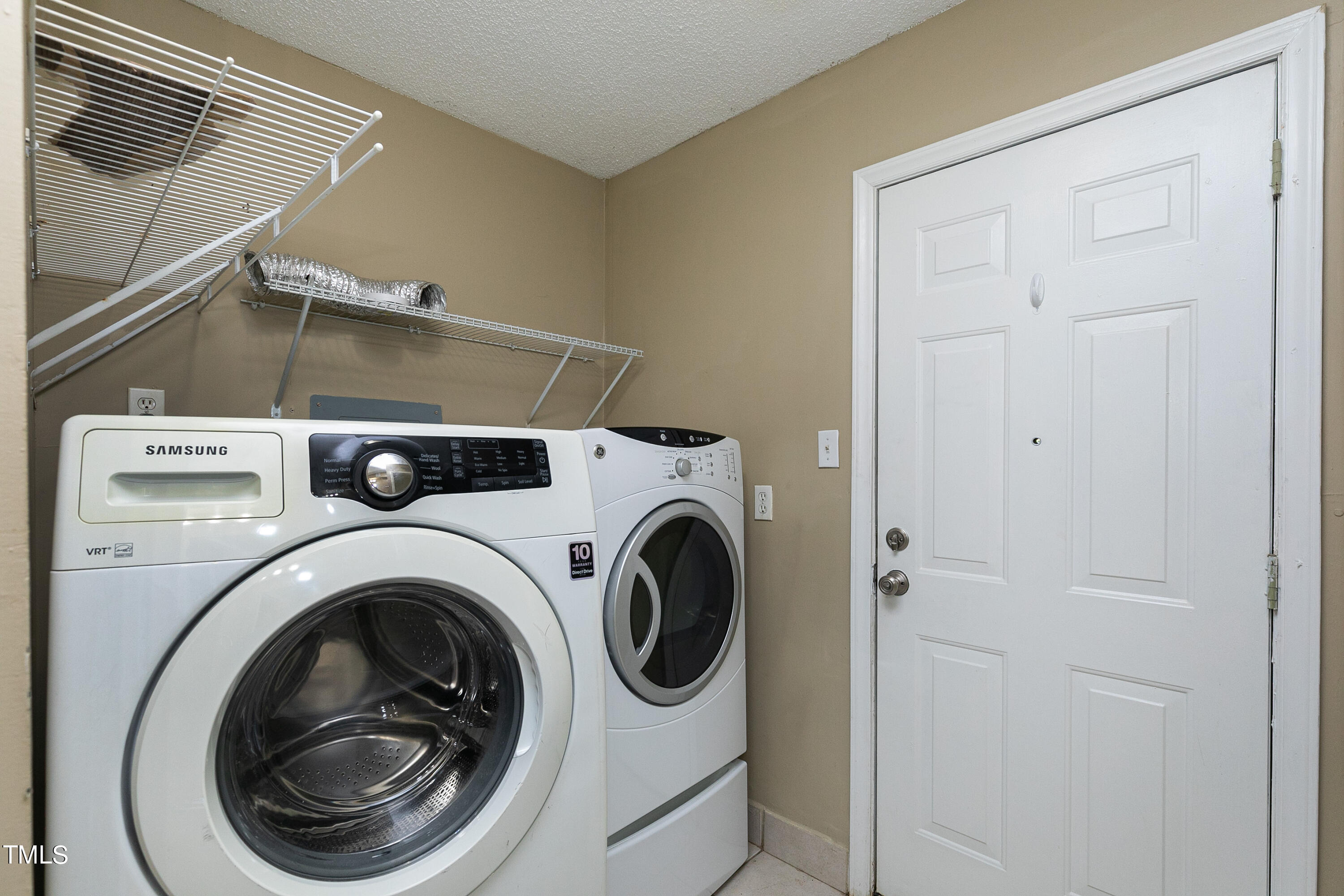 5841 Sandstone Drive Durham, NC 27713 - Photo 35 of 35 a utility room with dryer and washer