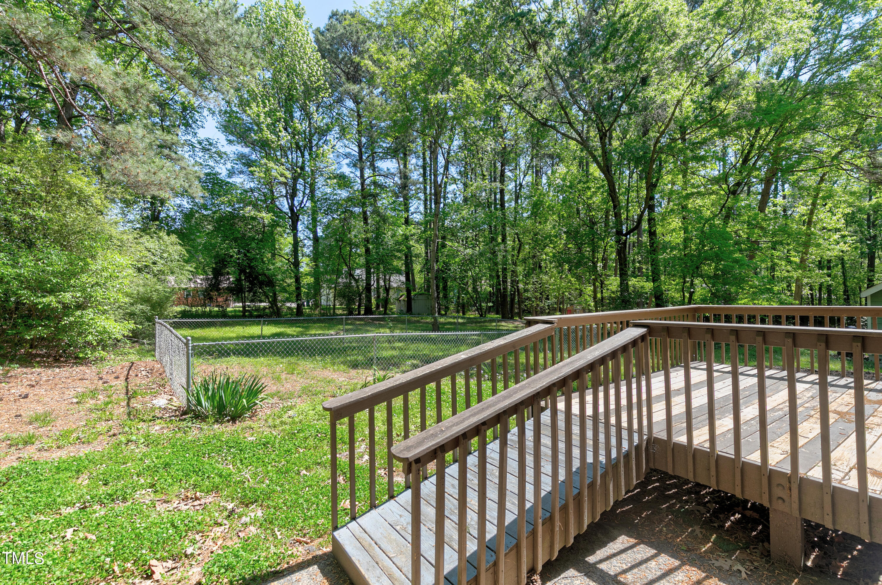 5841 Sandstone Drive Durham, NC 27713 - Photo 4 of 35 a view of backyard with a small deck