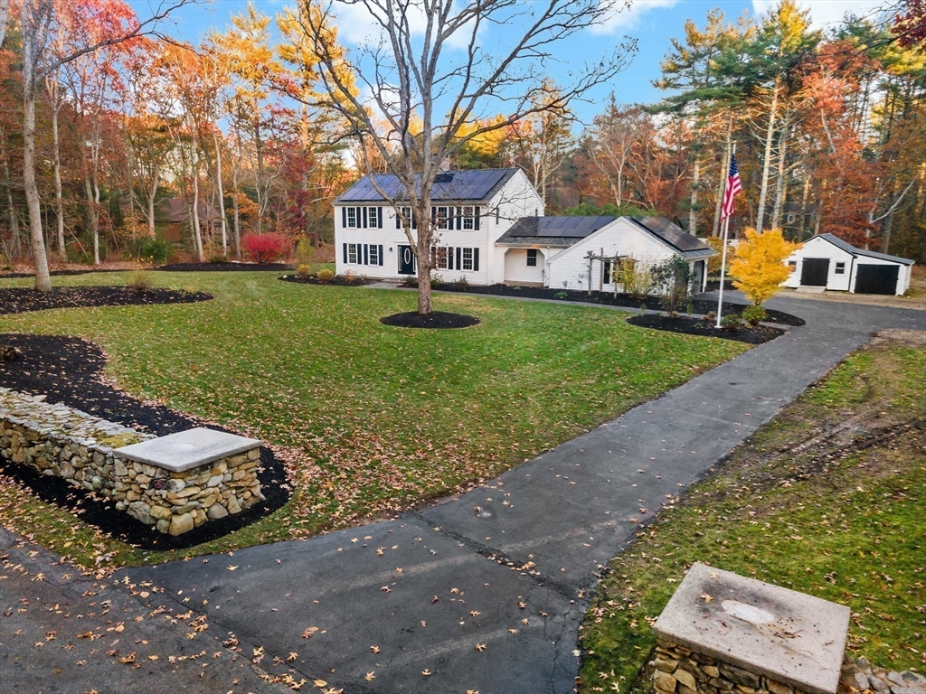 a view of multiple houses with a yard