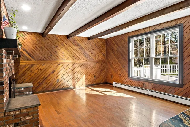 a view of an empty room with a fireplace