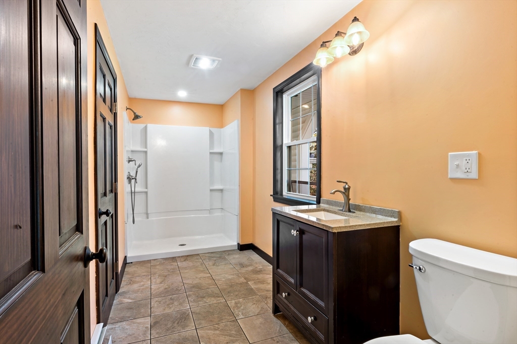 15 Hickory Ridge Road Rehoboth, MA 02769 - Photo 18 of 42 a bathroom with a sink a toilet and shower