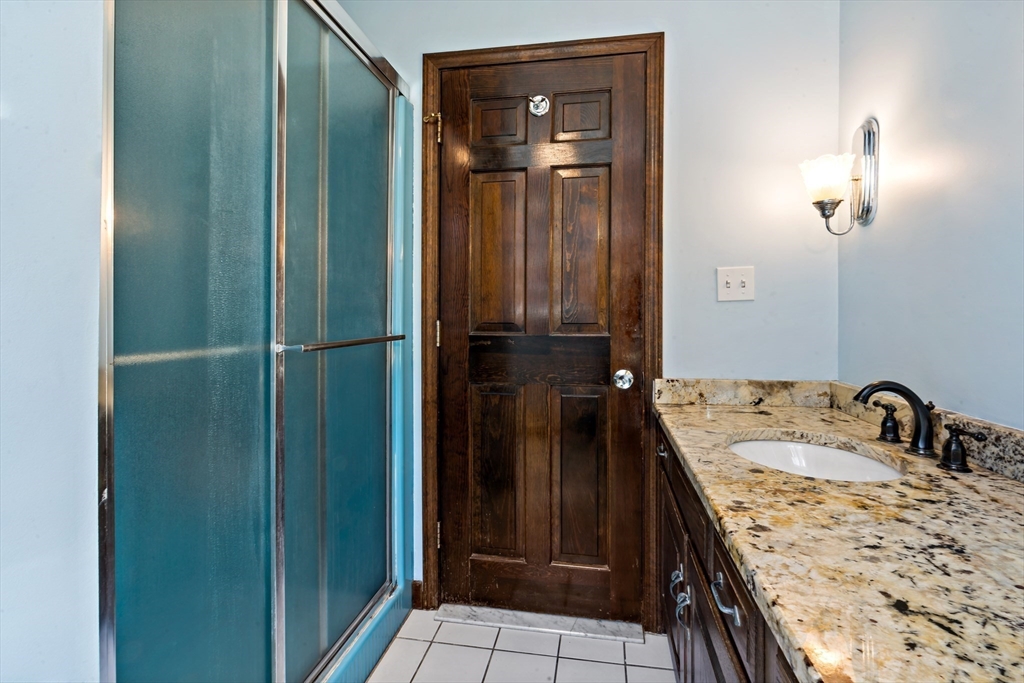 15 Hickory Ridge Road Rehoboth, MA 02769 - Photo 24 of 42 a bathroom with a sink and a mirror