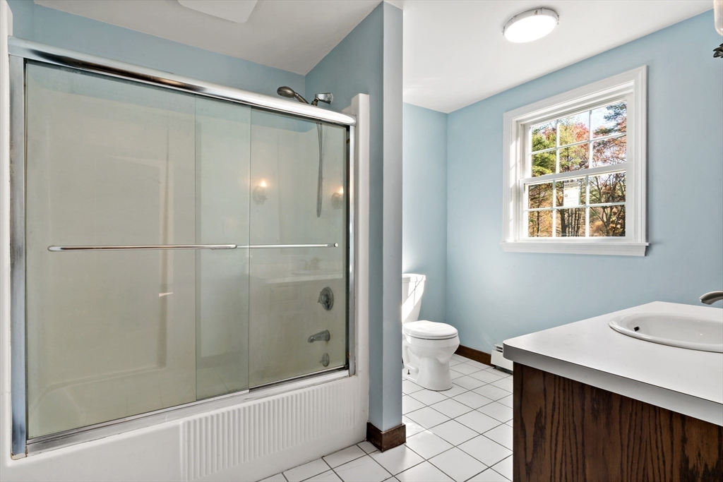 15 Hickory Ridge Road Rehoboth, MA 02769 - Photo 25 of 42 a bathroom with a granite countertop sink toilet and shower