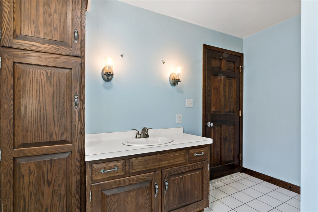 15 Hickory Ridge Road Rehoboth, MA 02769 - Photo 26 of 42 a bathroom with a sink and a mirror