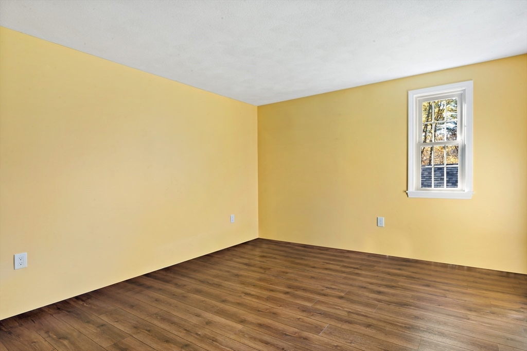 15 Hickory Ridge Road Rehoboth, MA 02769 - Photo 27 of 42 a view of an empty room with wooden floor and a window