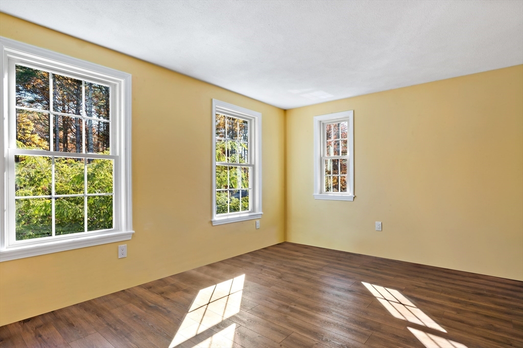 15 Hickory Ridge Road Rehoboth, MA 02769 - Photo 28 of 42 a view of an empty room with wooden floor and windows