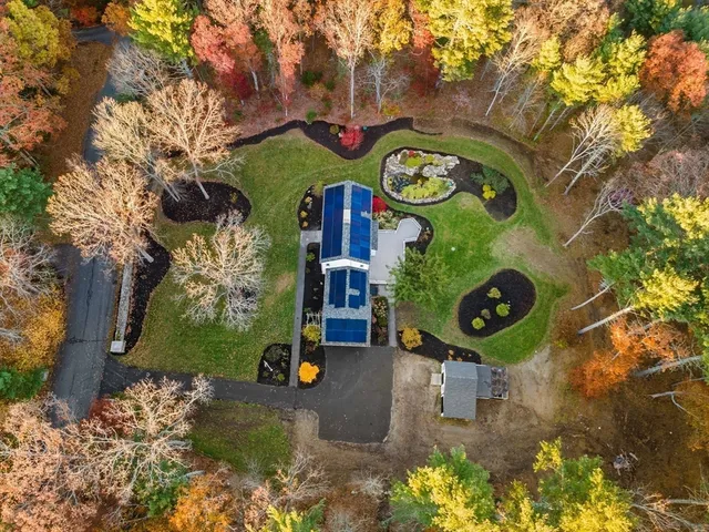 a kitchen with stainless steel appliances granite countertop a stove top oven a refrigerator and a microwave