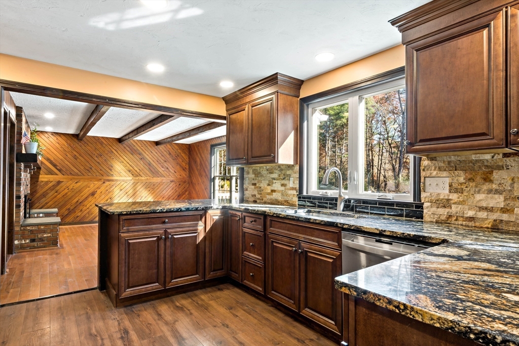 15 Hickory Ridge Road Rehoboth, MA 02769 - Photo 8 of 42 a kitchen with stainless steel appliances granite countertop a sink and wooden cabinets