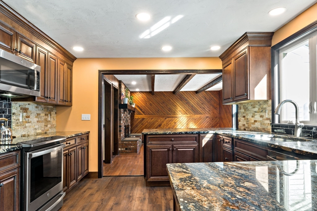 15 Hickory Ridge Road Rehoboth, MA 02769 - Photo 10 of 42 a kitchen with granite countertop a sink cabinets and stainless steel appliances