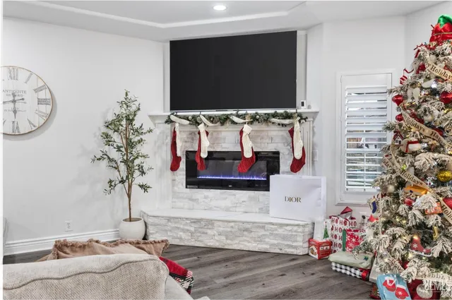 a living room with a flat screen tv and a couch