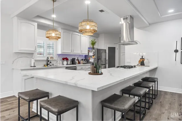 a kitchen with a table and chairs in it