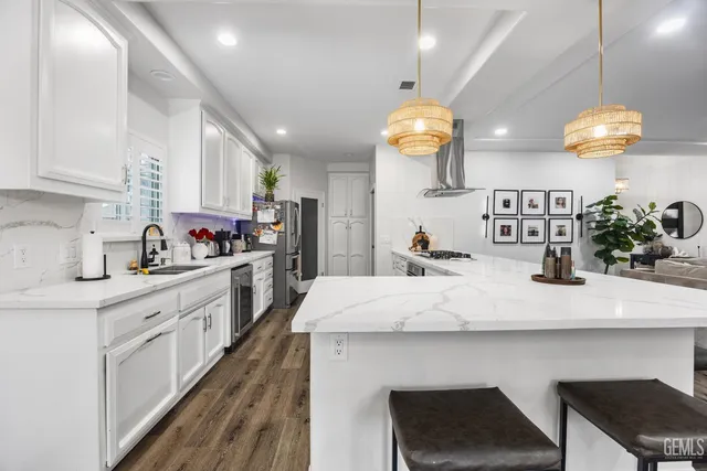 a kitchen with counter top space and cabinets