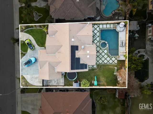 an aerial view of houses with outdoor space