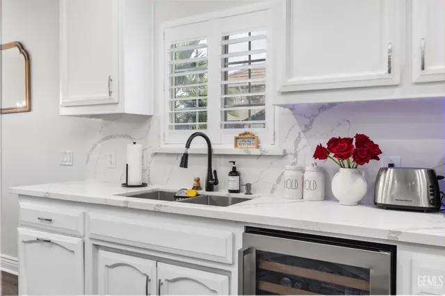 a kitchen with cabinets and window