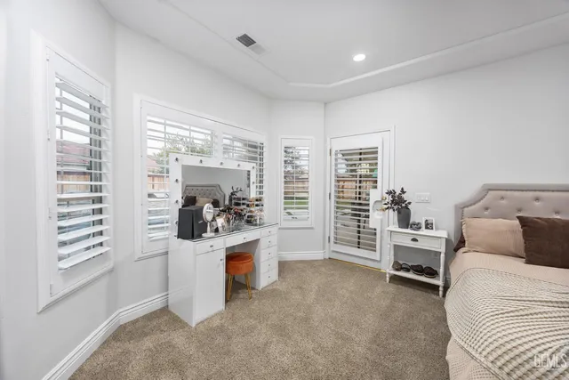 a bedroom with furniture and white walls