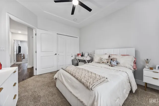 a bedroom with a bed and a couch