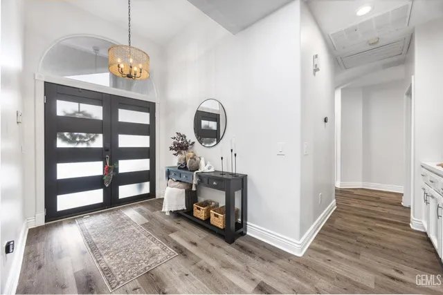 a view of an empty room and a window