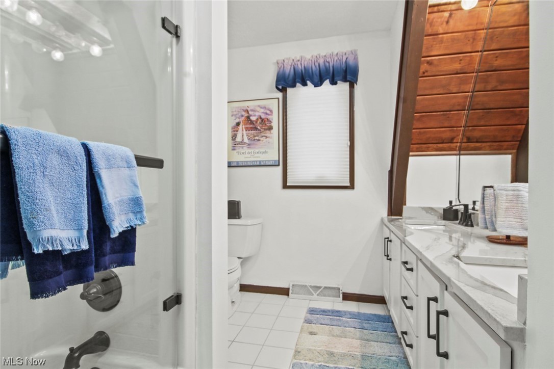 7550 South Raccoon Road Canfield, OH 44406 - Photo 20 of 32 Full bathroom featuring toilet, tile flooring, shower combination, and dual bowl vanity