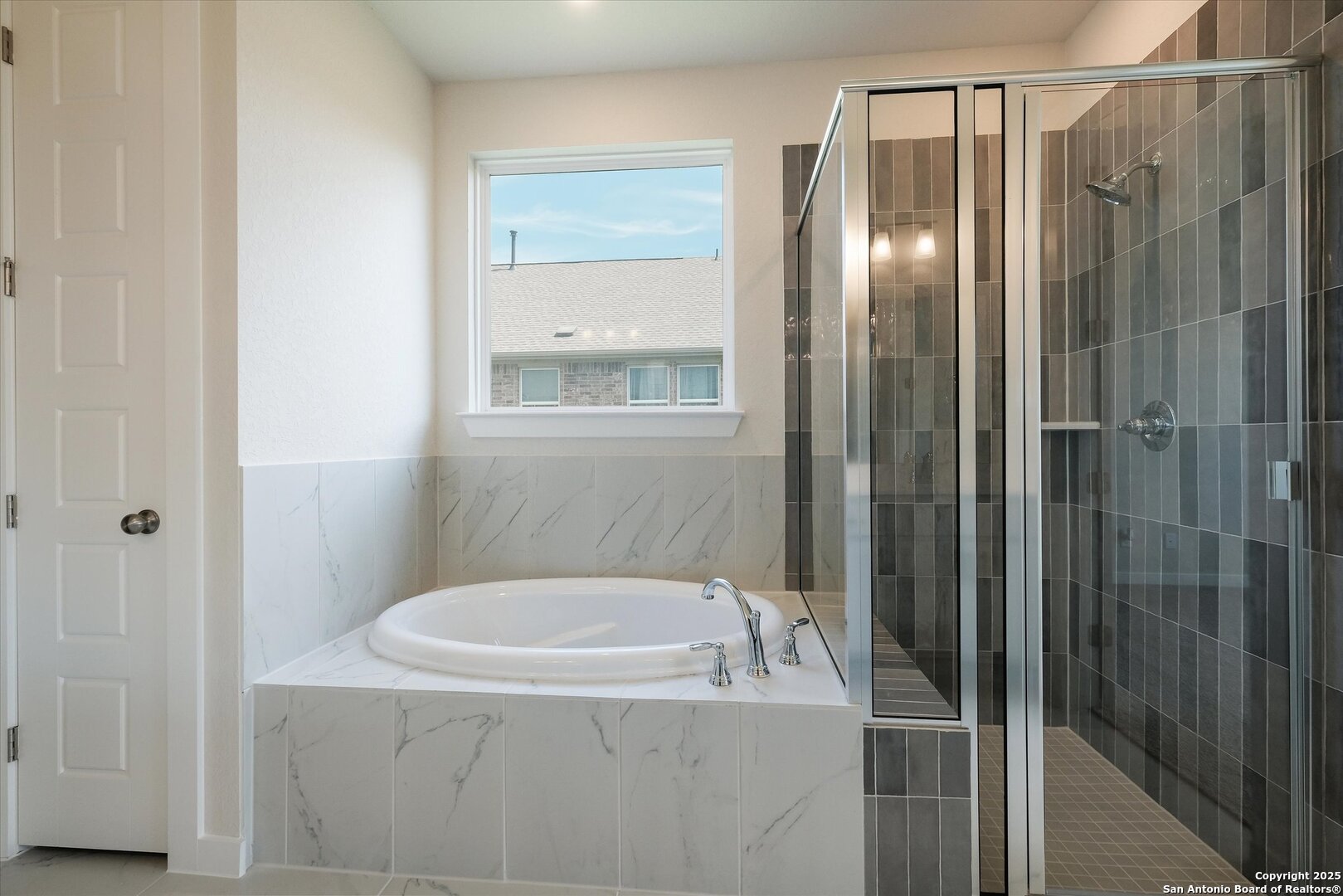 444 Foxbrook Way Cibolo, TX 78108 - Photo 16 of 32 a bathroom with bathtub and shower