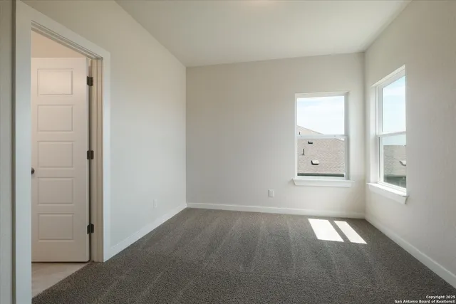 a view of empty room with windows