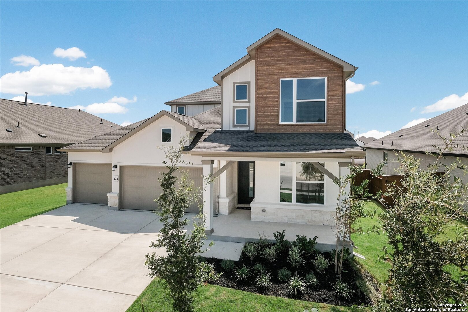 444 Foxbrook Way Cibolo, TX 78108 - Photo 2 of 32 a front view of a house with a yard and garage