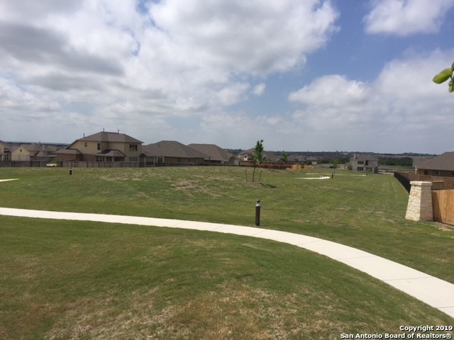 444 Foxbrook Way Cibolo, TX 78108 - Photo 30 of 32 a view of a lake with houses in the background