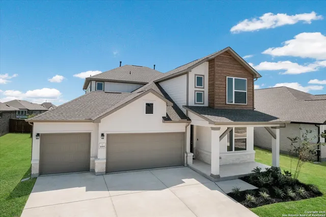 a front view of a house with yard